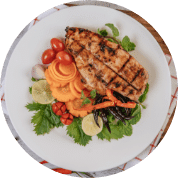 Chicken Steak with Lemon Tomato Chili Carrot White Plate